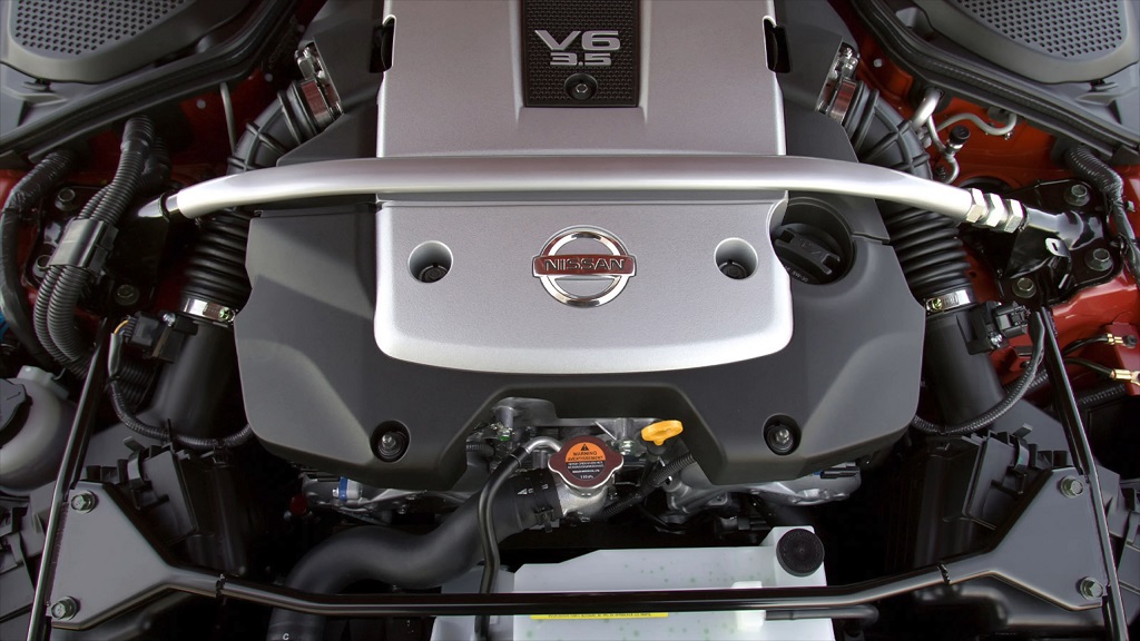 Nissan VQ series V6 engines with silver cover and visible strut bar